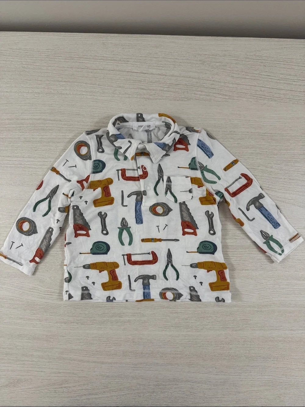 Angel Dear Long-Sleeve Polo with Multicolor Tool Print EUC Size 3-6M